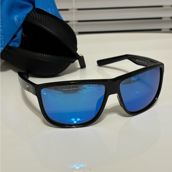 Costa Rincondo. Stylish Black Sunglasses with Blue Lenses